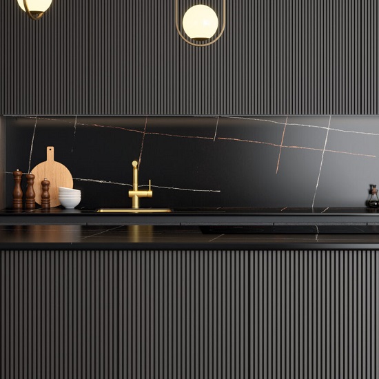 a black kitchen with worktops and a splashback in Quartzforms Planet Halley quartz