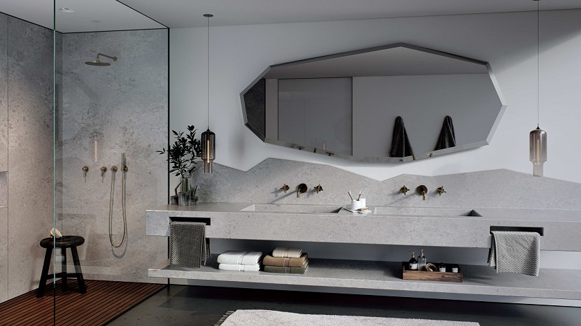 A feature wall in a bathroom in Caesarstone Airy Concrete