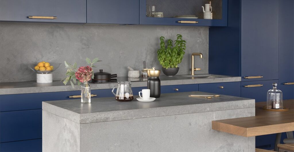 A feature wall in Caesarstone Rugged Concrete with matching kitchen island