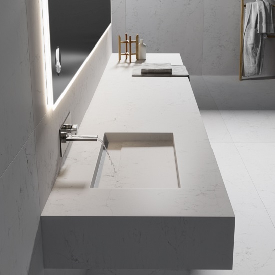 a photo of a vanity top in a bathroom with Compac Unique Arabescato glace finish quartz