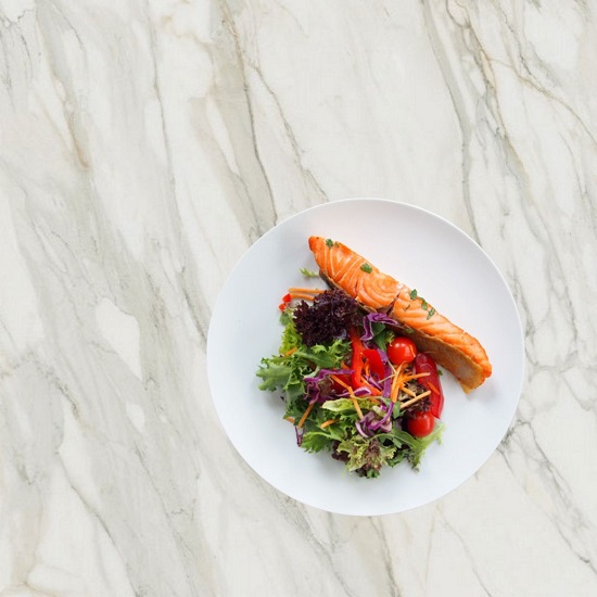 Caesarstone Mirabel 531 bird view with plate of salmon and salad