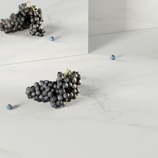 Caesarstone Snowdrift worktops with grapes and splashbacks with a mirror behind
