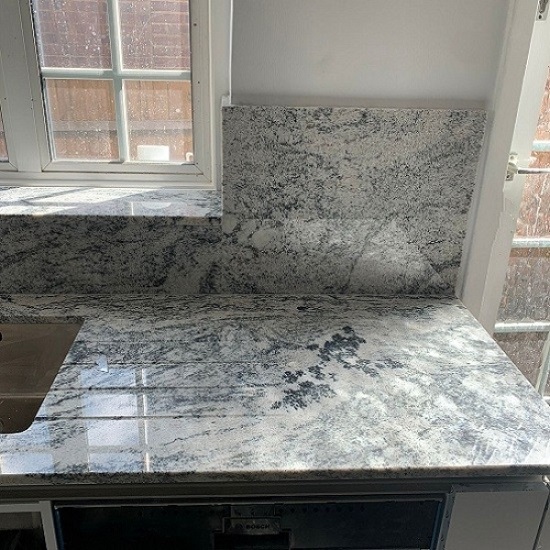 Cosmic White Granite A kitchen worktop installation in a london apartment in Cosmic White Granite