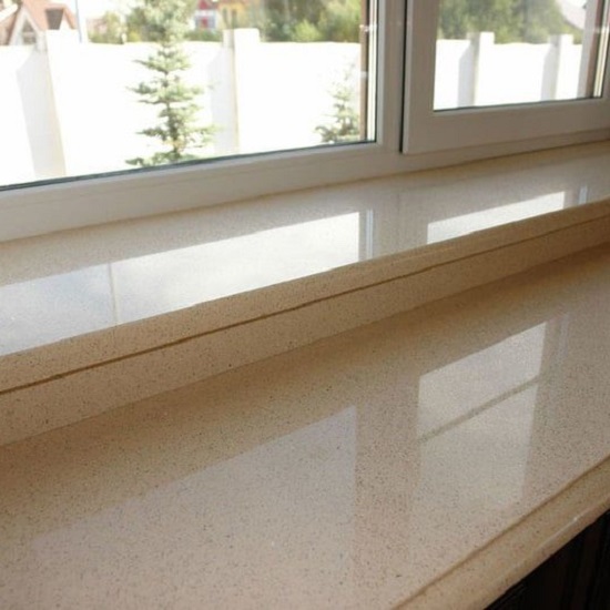 a window sill and kitchen worktops in A kitchen island with draining grooves in Quartzforms MA Beige quartz