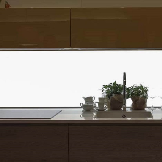 a photo of a minimalistic kitchen with Quartzforms Pebble Light Grey worktops in 20mm thickness