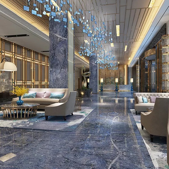 A hotel lobby with walls and floor covered in Bahama Blue granite