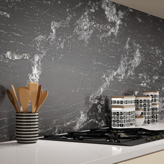 A kitchen splashback made from Black Beauty granite in leather finish with white worktops in a modern kitchen