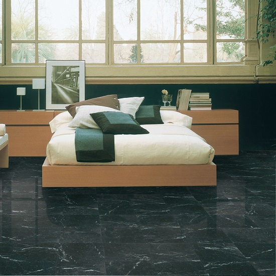a bedroom with Nero Marquina marble floor tiles