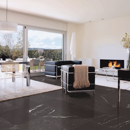 an open plan kitchen with Nero Marquina marble floors
