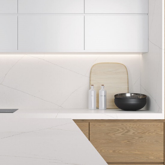 a minimalistic kitchen with wooden and white cabinets and Quartzforms Planet Honey Galaxy worktops