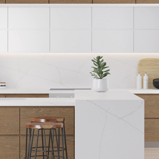 a white kitchen with Quartzforms Planet Honey Galaxy quartz worktops and kitchen island