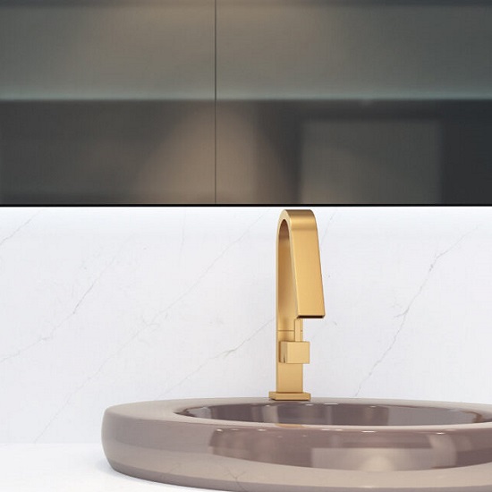 a bathroom with a Quartzforms Planet Venus quartz vanity top and a golden coloured tap