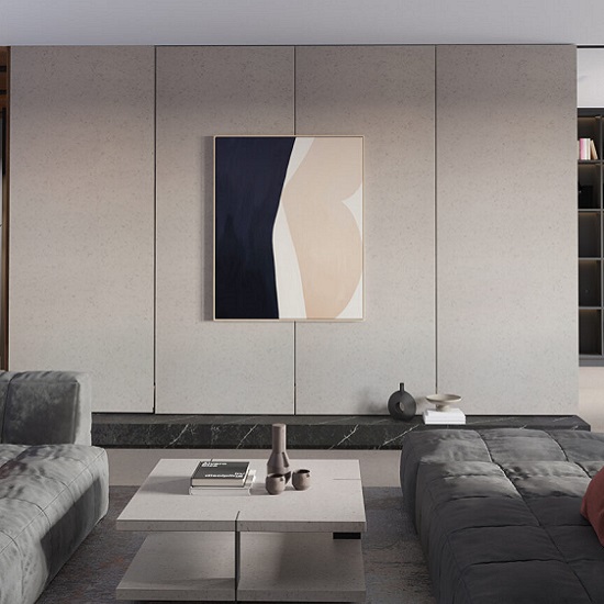 a modern living room with a wall and a coffee table in Quartzforms Veined Michelangelo quartz
