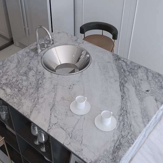 A photo of a kitchen island in Arabescato marble and a chair in a white kitchen