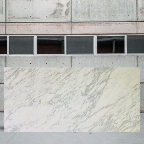 an image of a Calacatta Bettogli marble slab in a yard