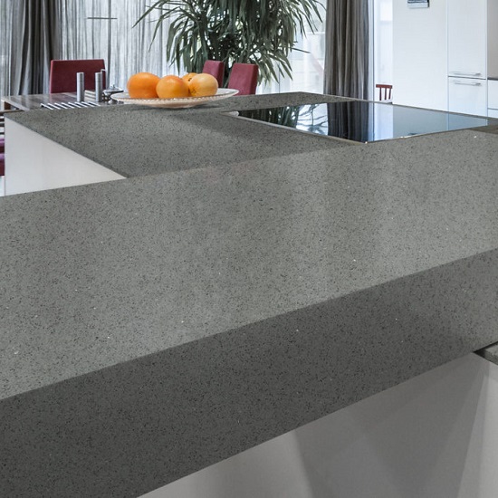 a breakfast bar made from CRL Quartz Grey Shimmer in a white kitchen