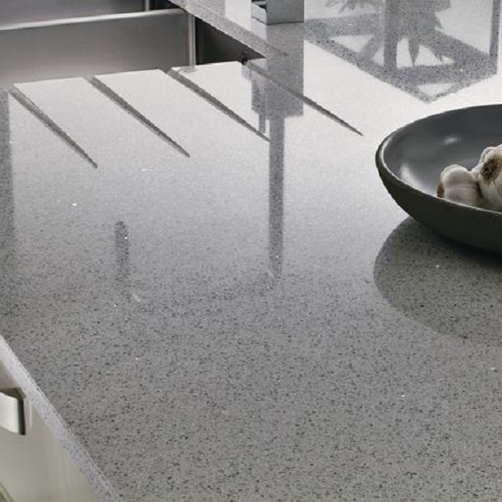 a CRL Quartz Grey Shimmer kitchen worktop with draining grooves and a fruit bowl