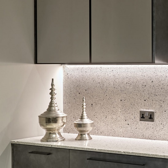 a grey kitchen with CRL Quartz Venetian Arte worktops and wall
