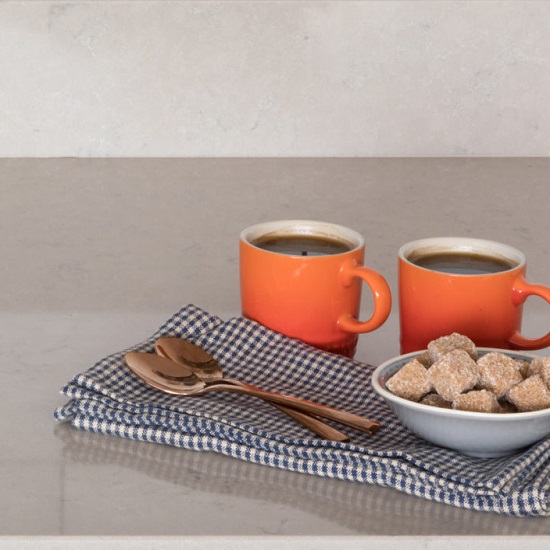 CRL Quartz Antico worktops with a tray and two orange coffee cups