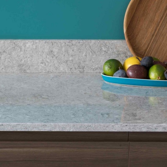 a CRL Quartz Montana Gris kitchen worktop and upstand, a chopping board, and a tray with fruits