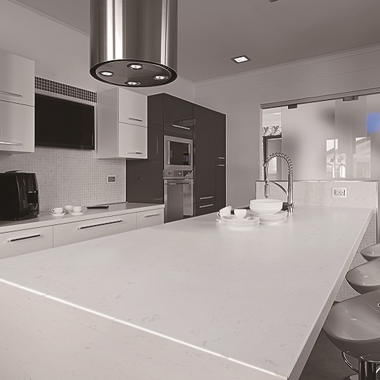 a CRL Quartz Regency White kitchen island in a white kitchen