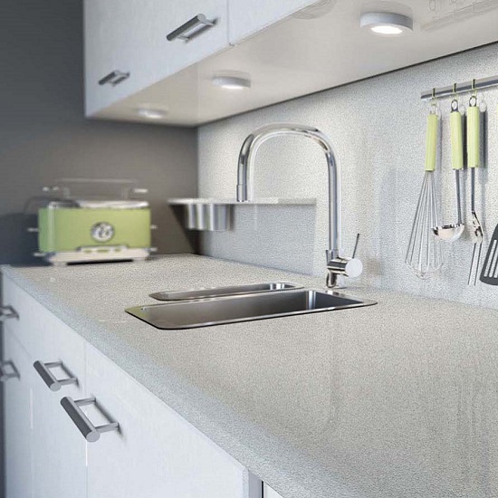 a modern kitchen with CRL Quartz Silver Shimmer countertops, a steel tap, and a green bread toaster