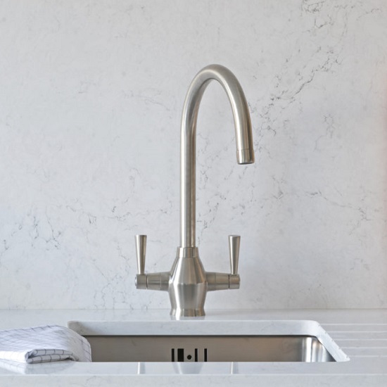 a CRL Quartz Statuario Bianco worktop and matching splashback behind a tap