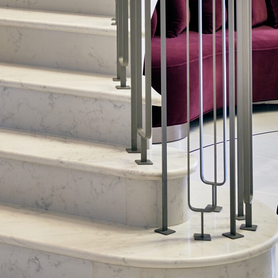 a staircase in CRL Quartz Verona and metal handles