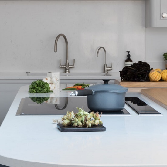 a CRL Quartz White Carrara kitchen island in a contemporary kitchen