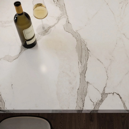 a table top in Dekton Daze with a bottle and a glass of wine