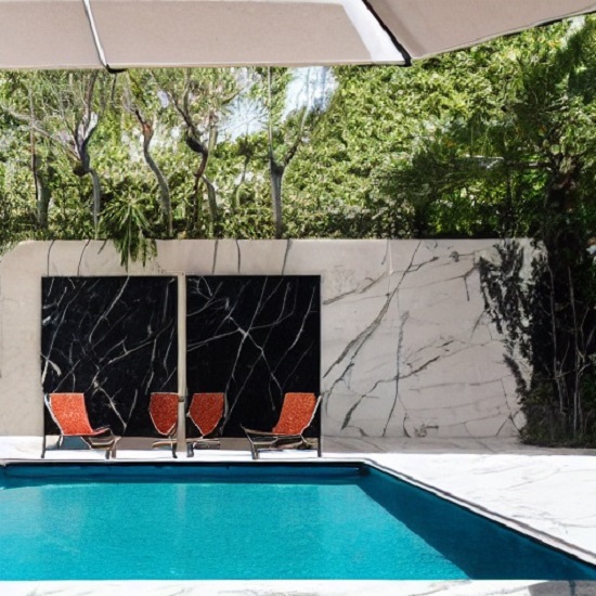 a photo of a garden with Nero Marquina marble on the walls