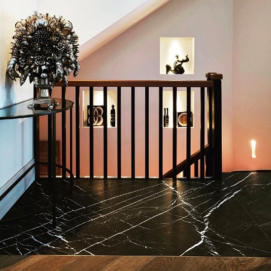 a hallway with Nero Marquina marble floors