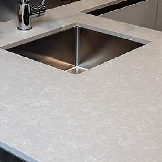 a photo of Quartzforms Fossil Nacre quartz worktops with a sink and a tap