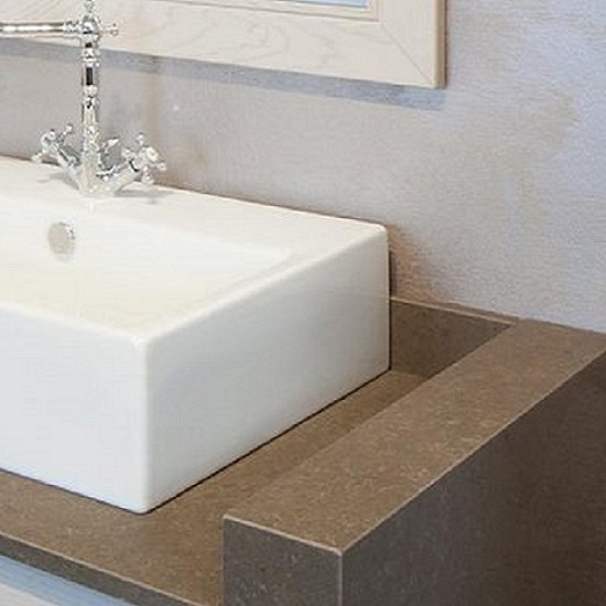 a Vanity top in Quartzforms Cloudy Brown quartz with a white porcelain sink and steel tap