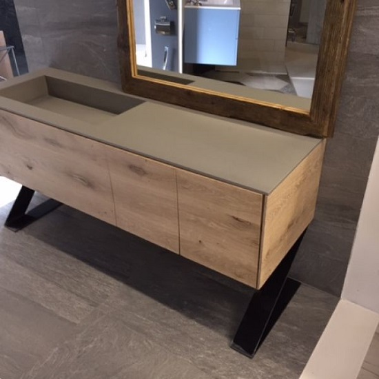 a photo of a vanity top made in Quartzforms Cloudy Portland Grey quartz and a wooden cabinet