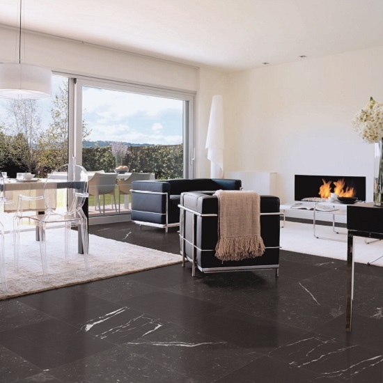 a photo of a living room with Nero Marquina honed marble tiles