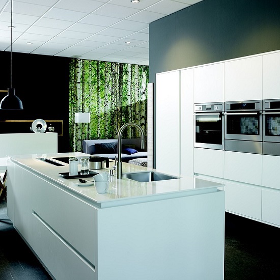 photo of an island in a white kitchen with Acqua Bianca marble