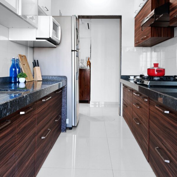 a photo of a white kitchen with Blue Pearl granite worktops