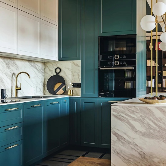 a photo of a blue kitchen with Calacatta Vagli Oro marble countertops