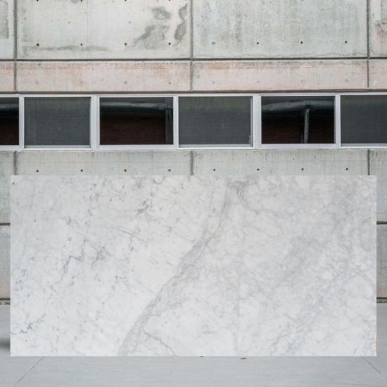 an image of a Carrara C Extra marble slab in a yard