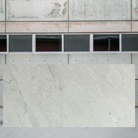 an image of a Carrara CD marble slab outside a yard