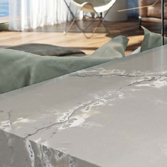 a kitchen island surface in Compac Ice White quartz