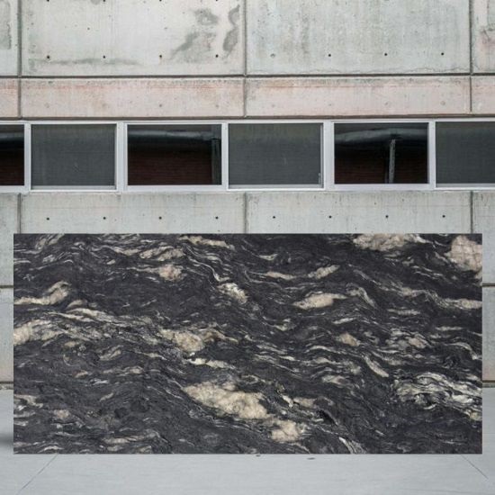 an image of a Cosmic Black granite slab in a yard