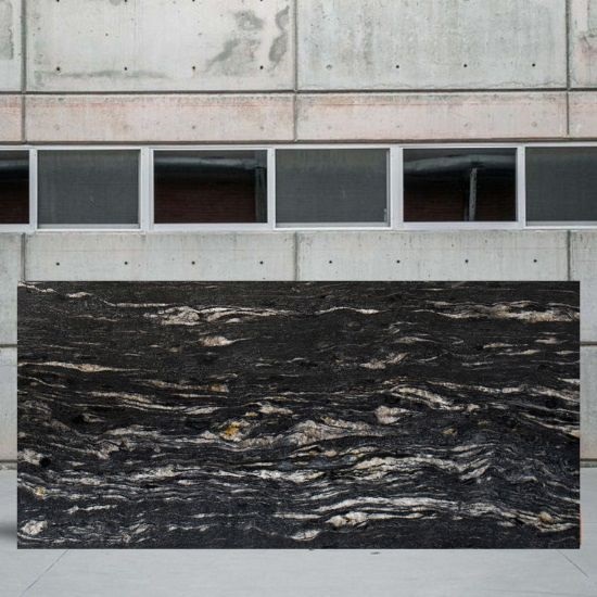 an image of a Cosmic Black granite slab and a grey wall behind