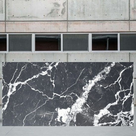 an image of a Nero Marquina honed marble slab in a yard