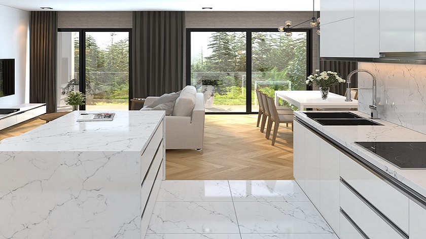 a modern kitchen with Unistone Carrara Venatino worktops, floors, and walls