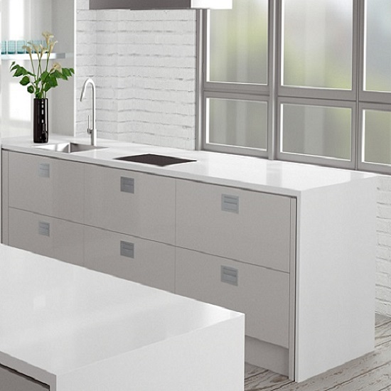 a white kitchen with a Compac Absolute Blanc breakfast bar and island