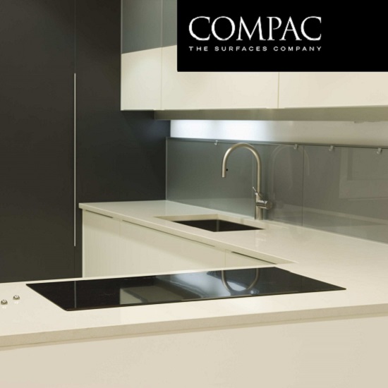 a kitchen with Compac Glaciar worktops and the Compac Quartz label