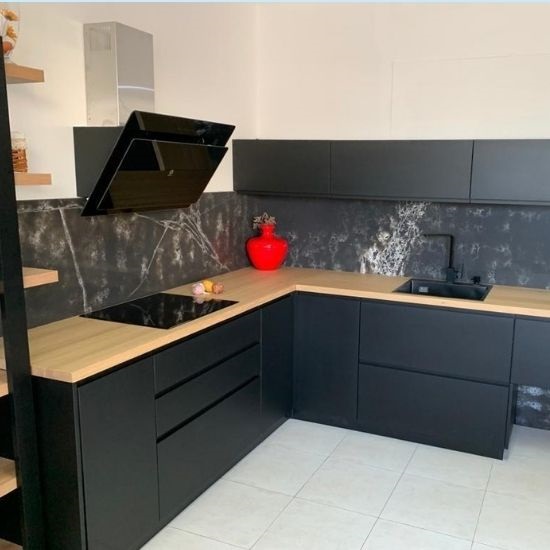 a photo of kitchen worktops and splashbacks made from Compac Ice Max Black quartz