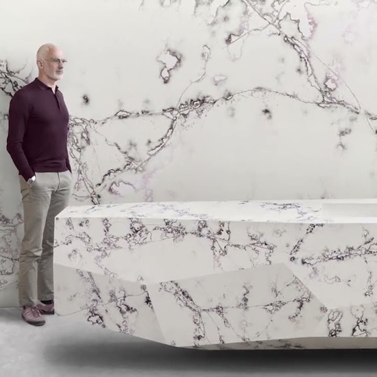 Arik Levy next to a Compac Ice Viola bathtub